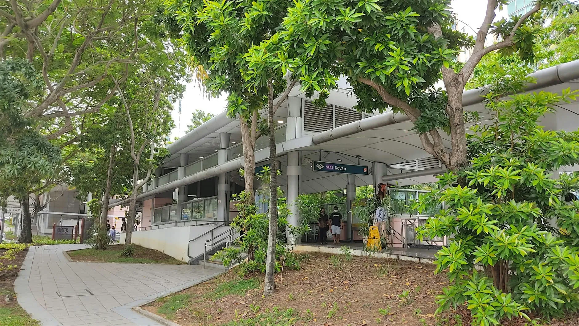 A Singapore MRT station entrance in a leafy residential neighbourhood
