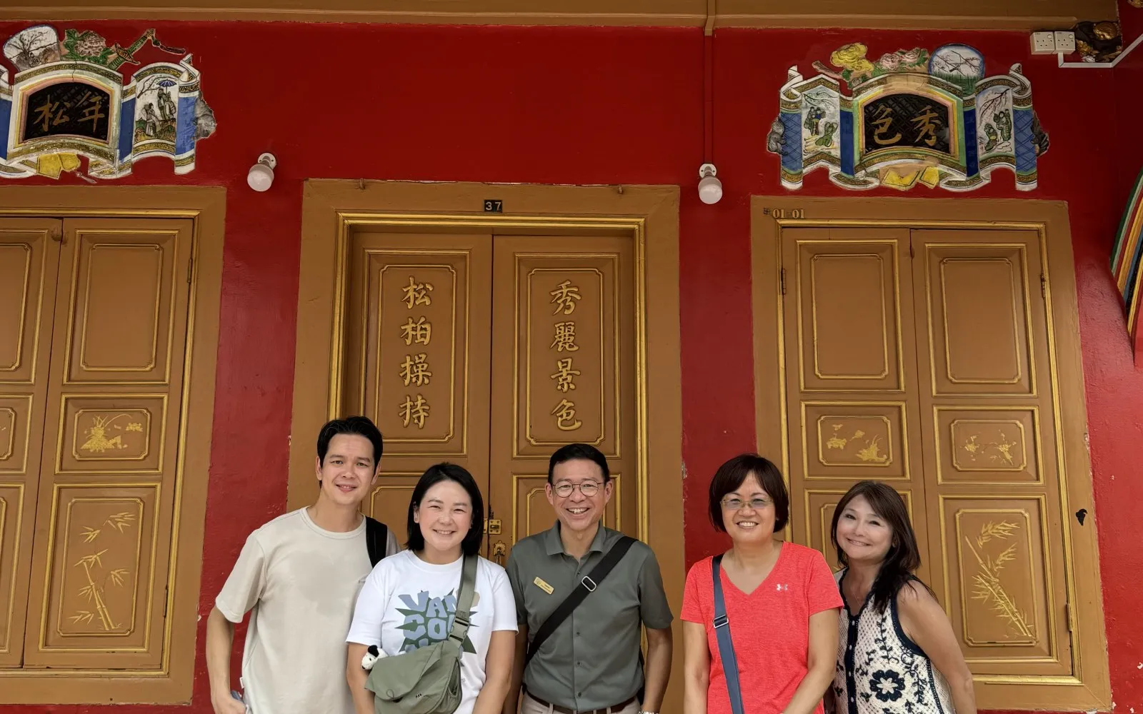Guided group walking tour inside a Little India temple