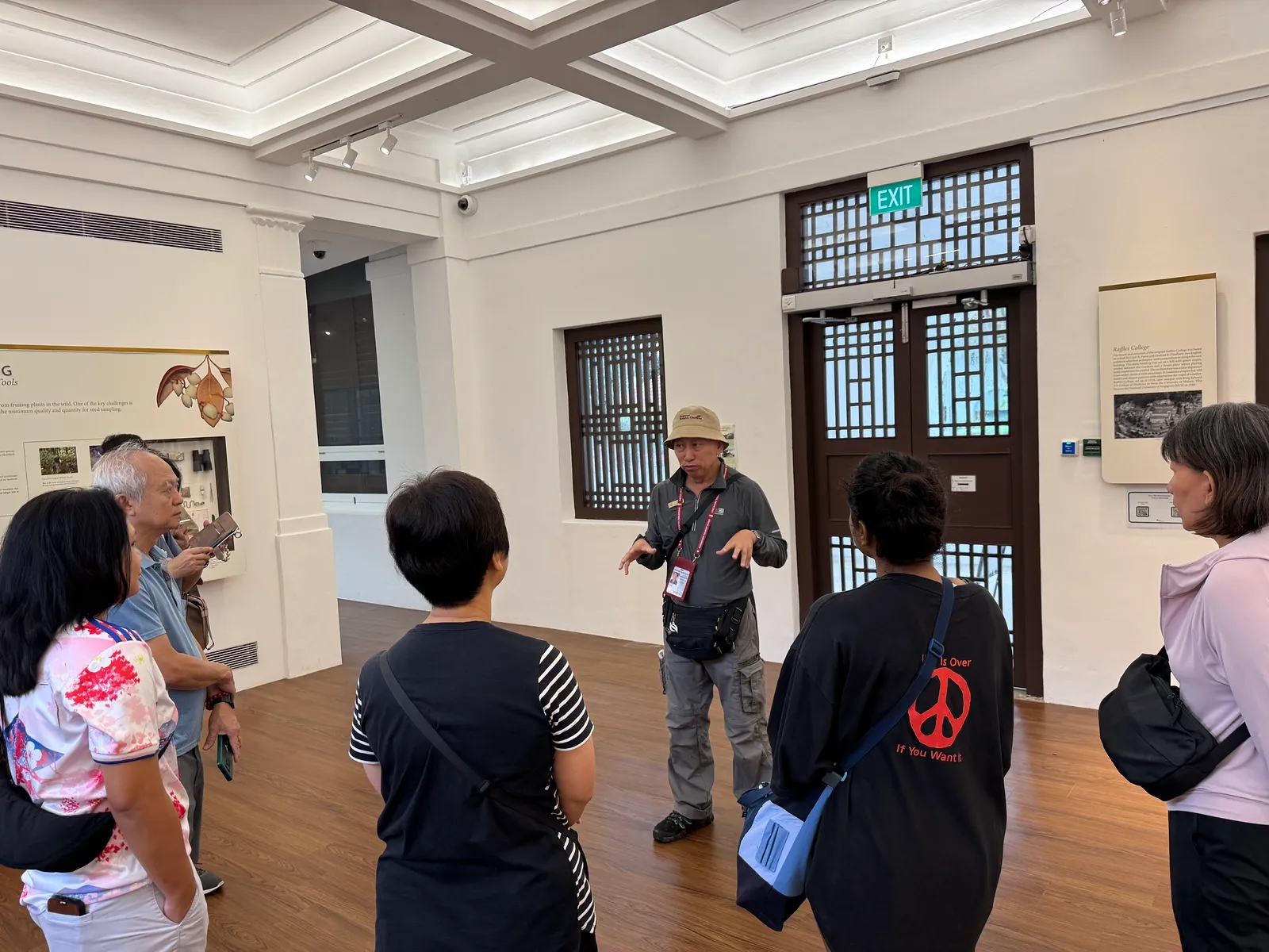 A guide leading a group through a Botanic Gardens heritage exhibit